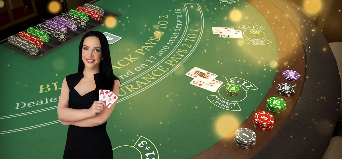 Promotional casino image of a smiling blackjack dealer in a black dress holding cards in front of a green blackjack table with betting circles, scattered playing cards, and stacks of colourful chips under glowing bokeh lights.
